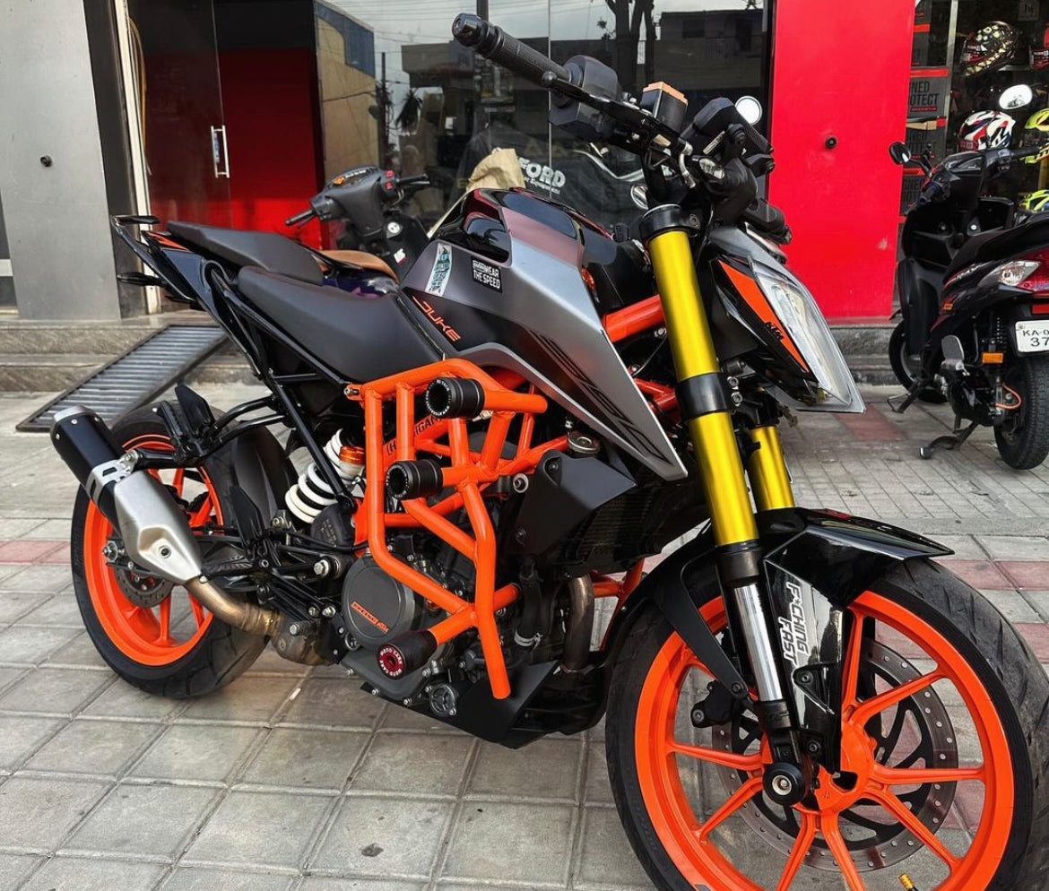 CRASH GUARD WITH METAL SLIDER for DUKE 250/390 BS6 ORANGE – SB 591 / Ht Exhaust