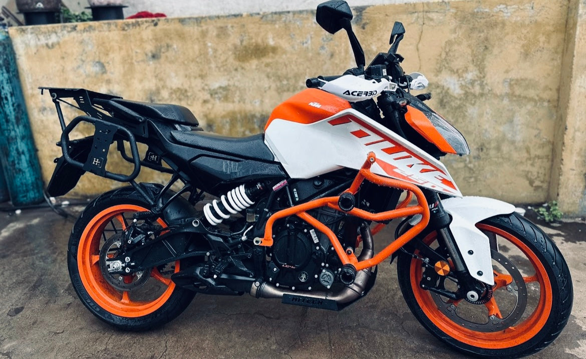 CRASH GUARD WITH METAL SLIDER for DUKE 250/390 BS6 ORANGE – SB 591 / Ht Exhaust