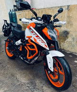 CRASH GUARD WITH METAL SLIDER for DUKE 250/390 BS6  ORANGE  – SB 591 / Ht Exhaust